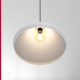 A white cone-shaped pendant light suspended against a neutral background.